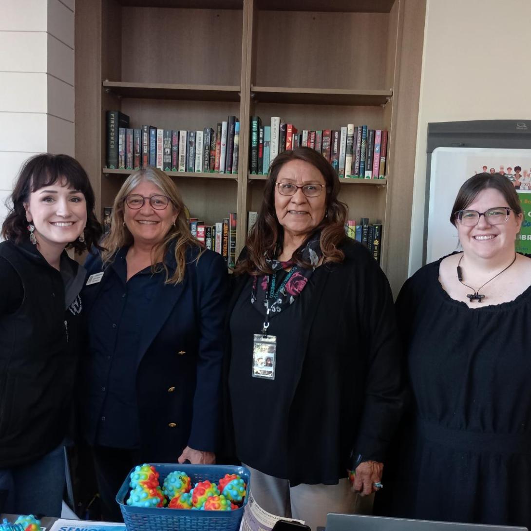 library employees and country representatives Patrice Horstman and Judy Begay pose together in front of the library booth at the 2025 High Country Stand Down
